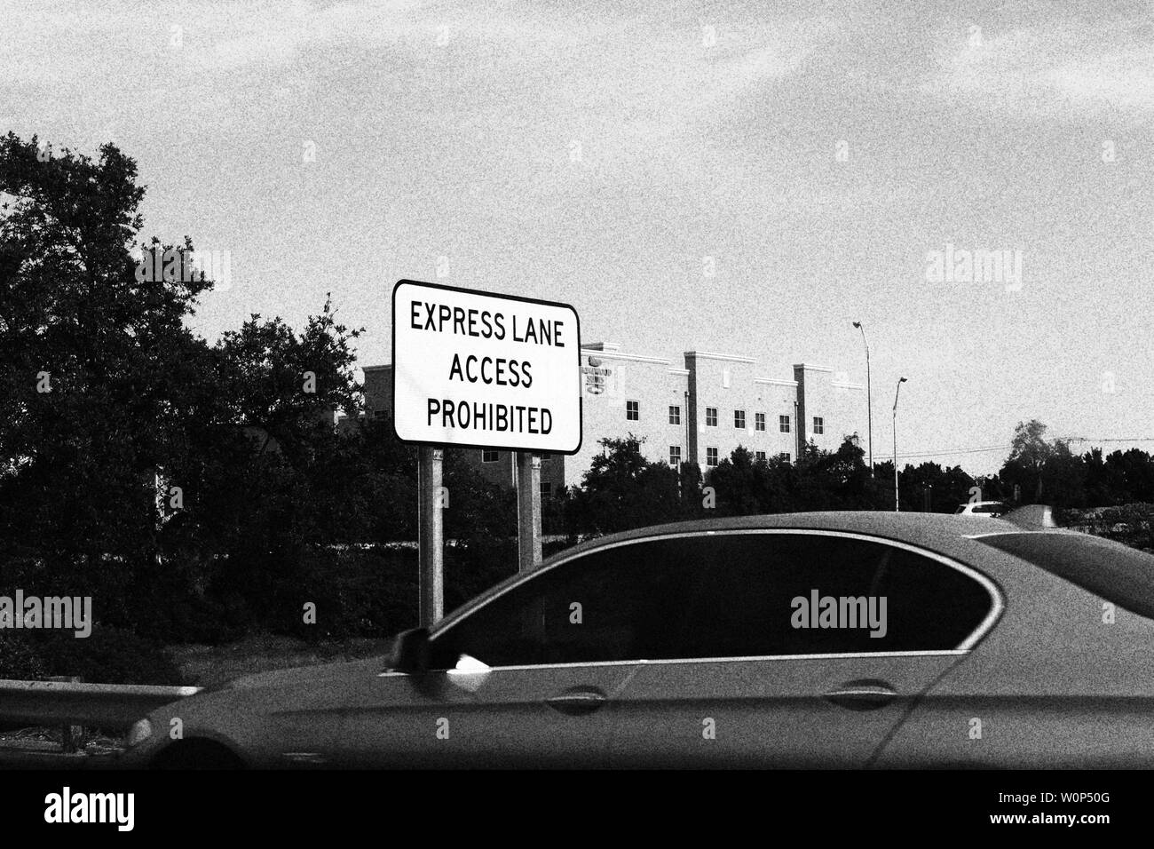 Express lane access prohibited sign black and white photograph Stock Photo