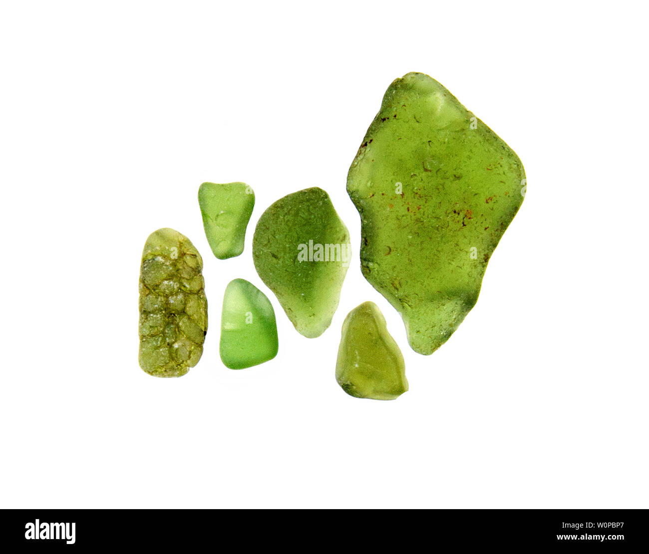Green sea glass photographed on a light box with white background. Stock Photo