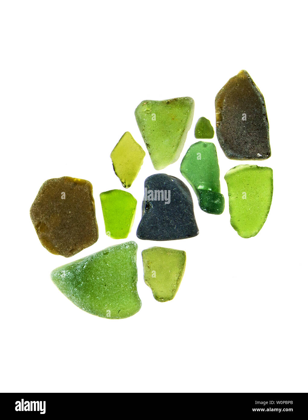 Green sea glass photographed on a light box with white background. Stock Photo