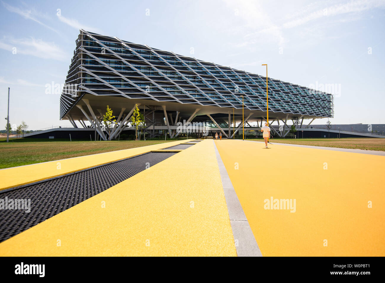 Herzogenaurach, Germany. 26th June, 2019. The new office building "Arena"  by Adidas. On the left in the picture trampolines for the employees are  worked into the path. In the 70th year of