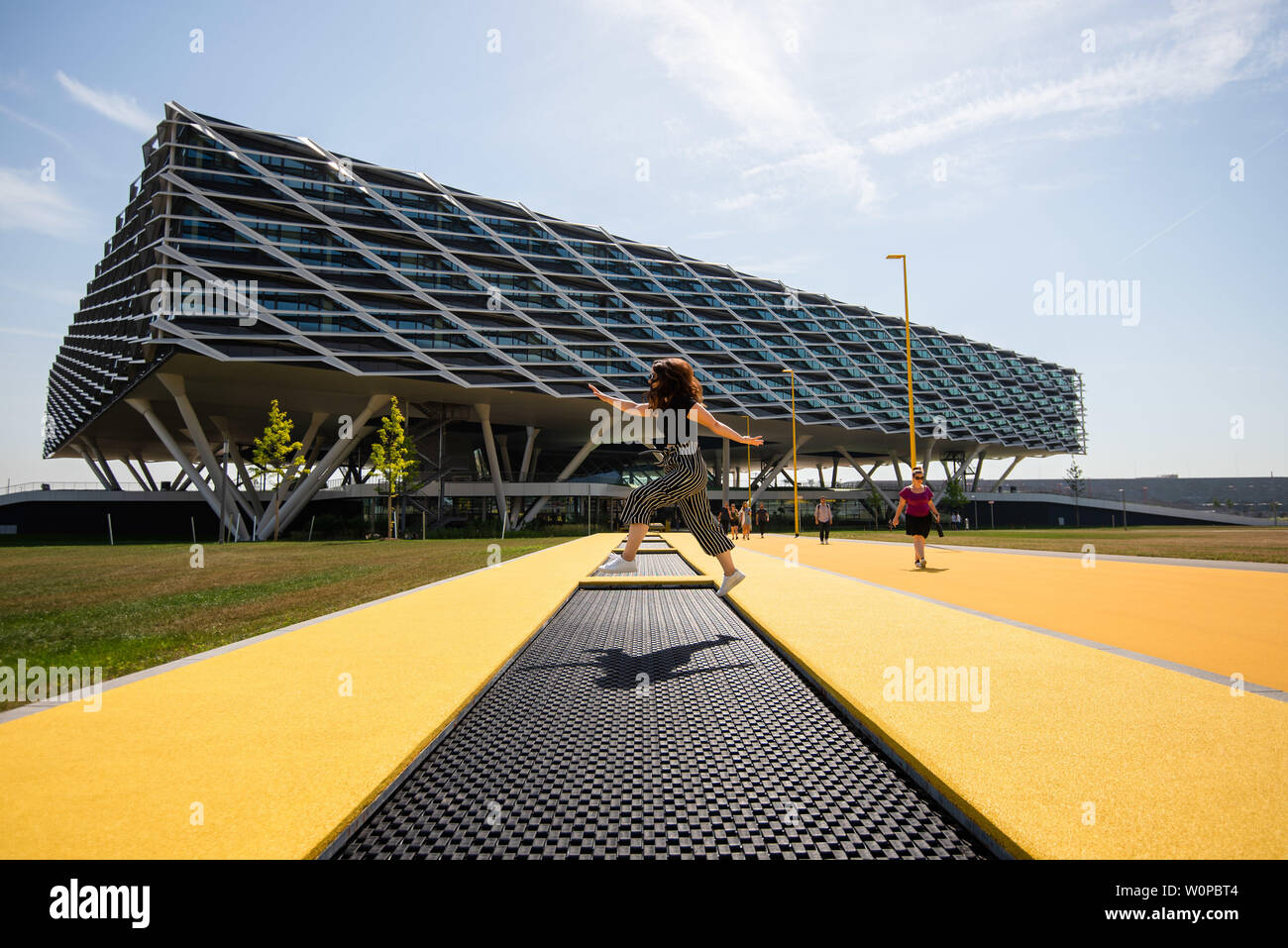 Herzogenaurach, Germany. 26th June, 2019. The new office building "Arena" by Adidas. Trampolines for the employees are incorporated the path. In the 70th year of its existence, the sporting goods manufacturer