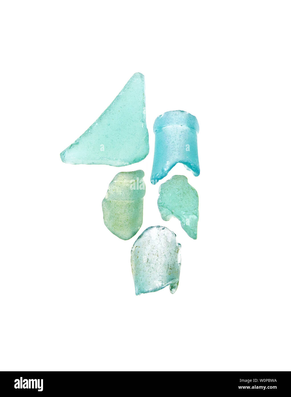 Sea glass in shades of blue and aqua photographed on a white background. Stock Photo