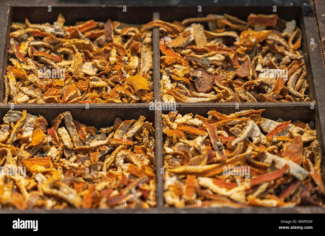 orange peel in tobacco Dried orange peel in a wooden box Stock Photo