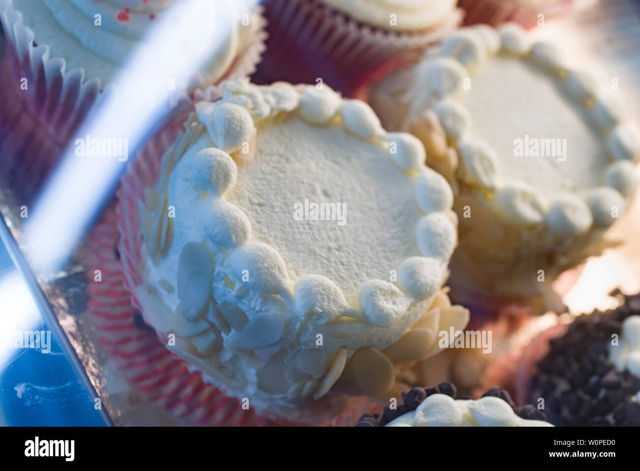 cakes in a display case in a bakery Stock Photo Alamy