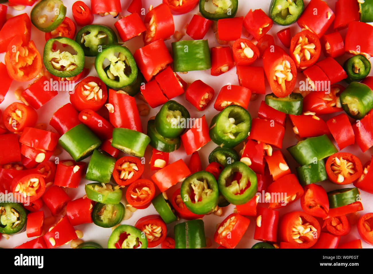 One red and many green peppers hi-res stock photography and images - Alamy