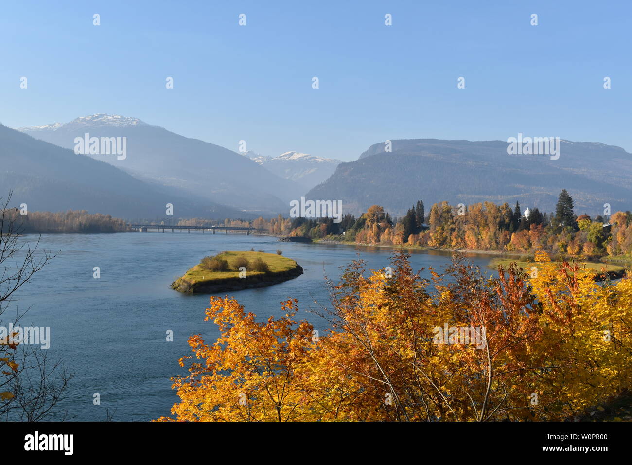 The Columbia River meandering through Revelstoke, BC, on a sunny autumn day Stock Photo