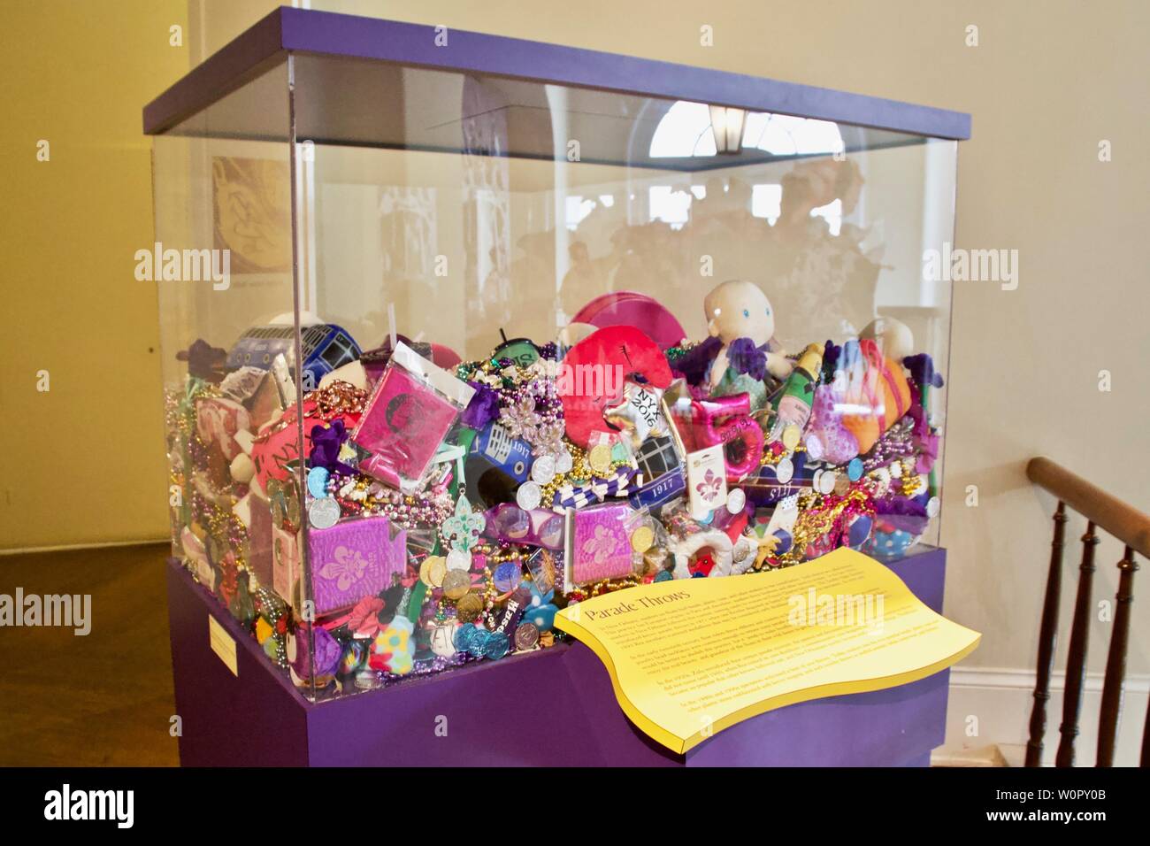 A glass box full of Mardi Gras parade throws in New Orleans Stock Photo