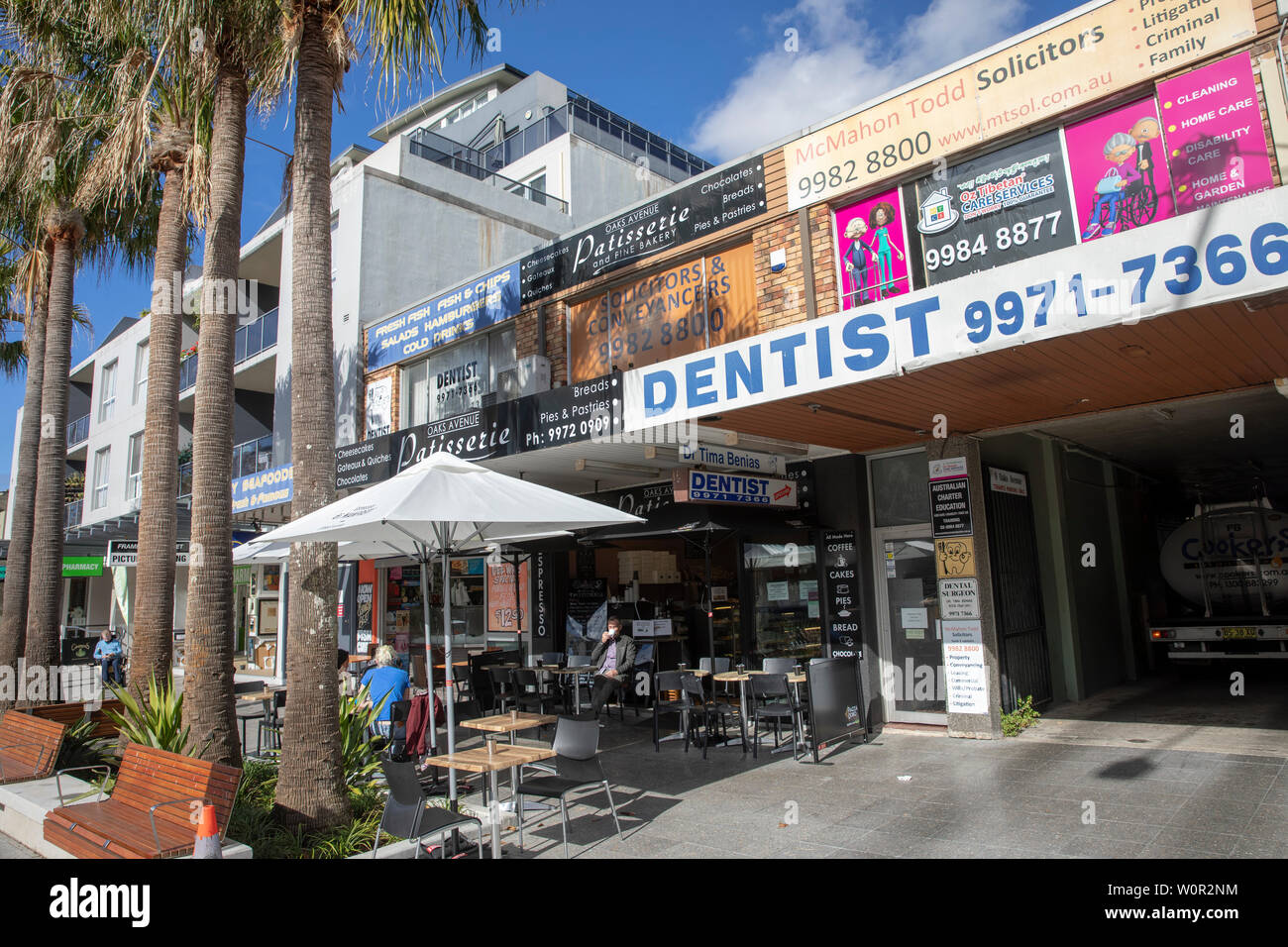 Dee Why in Sydney, shops and stores on Oaks Avenue including dentist and solicitors,Sydney,Australia Stock Photo