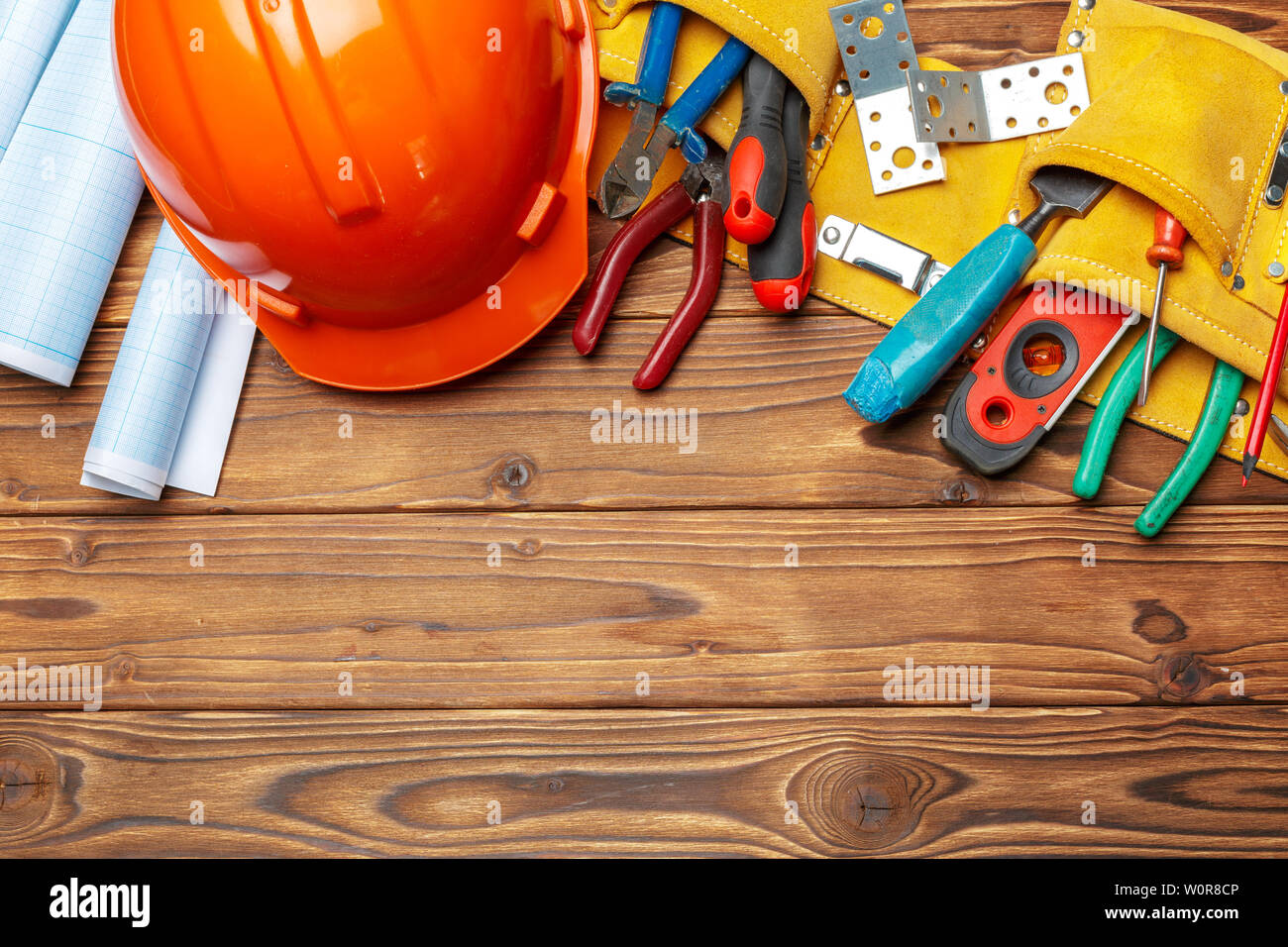 Assorted work tools on wooden table Stock Photo