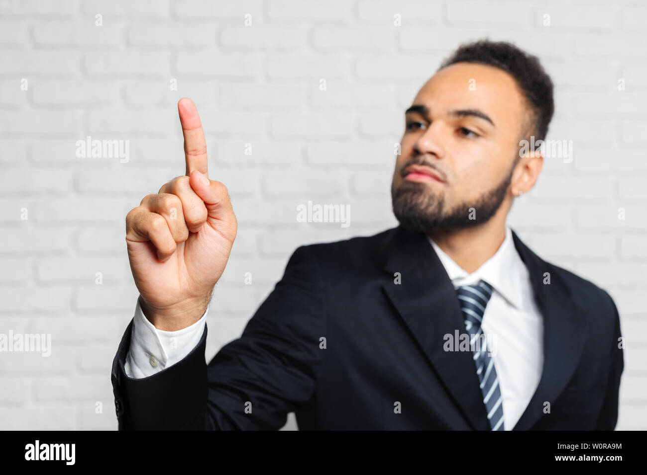 Business man touching an imaginary screen Stock Photo