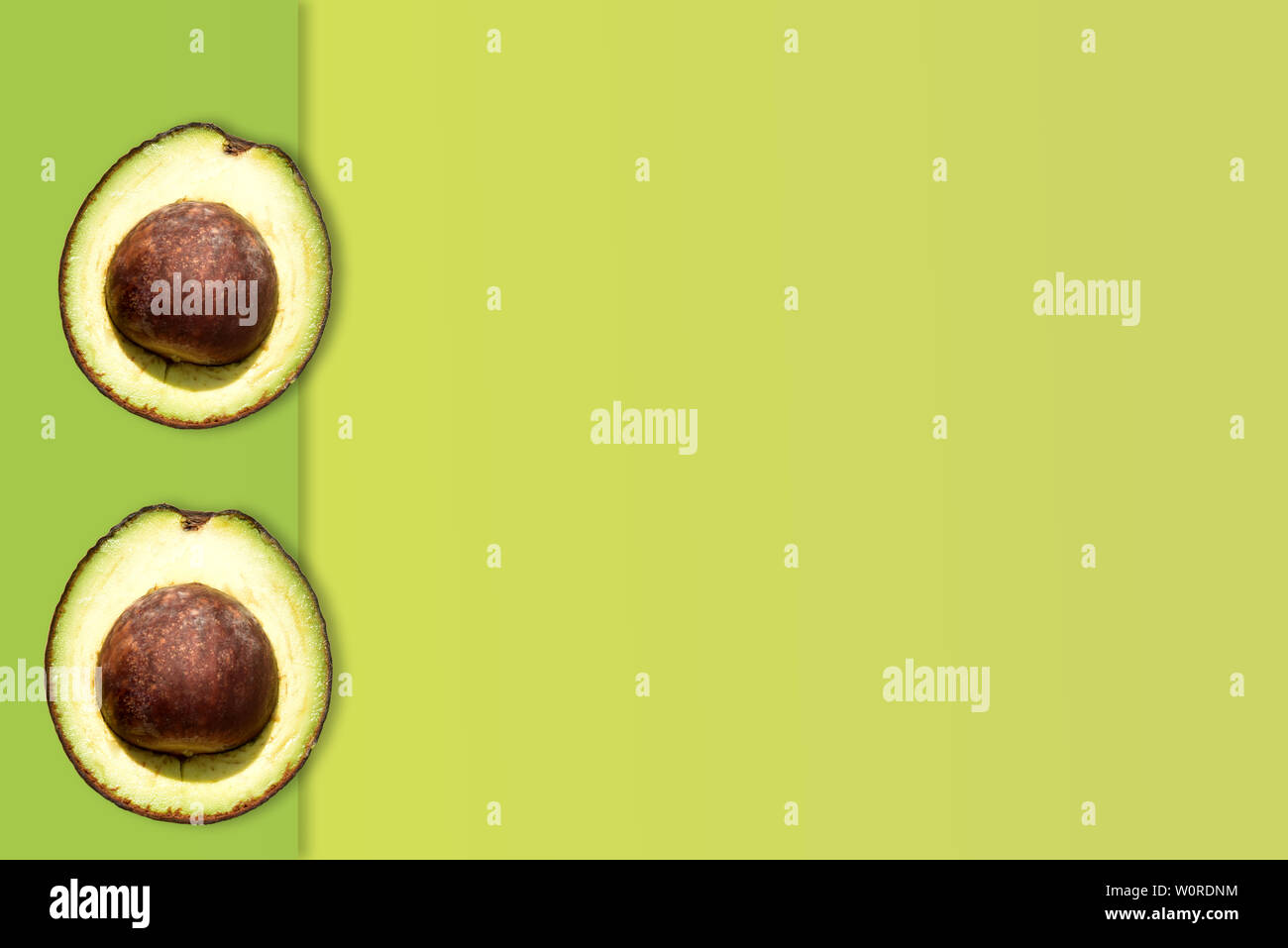 Creative layout made of avocado on the green background. Flat lay. Food ...