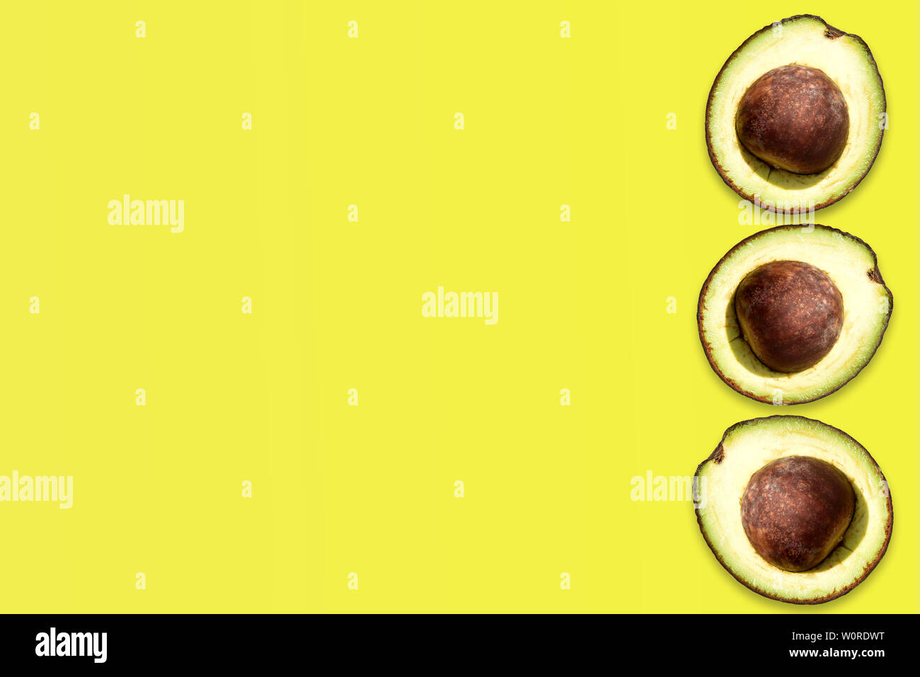 Creative layout made of avocado on the green background. Flat lay. Food ...