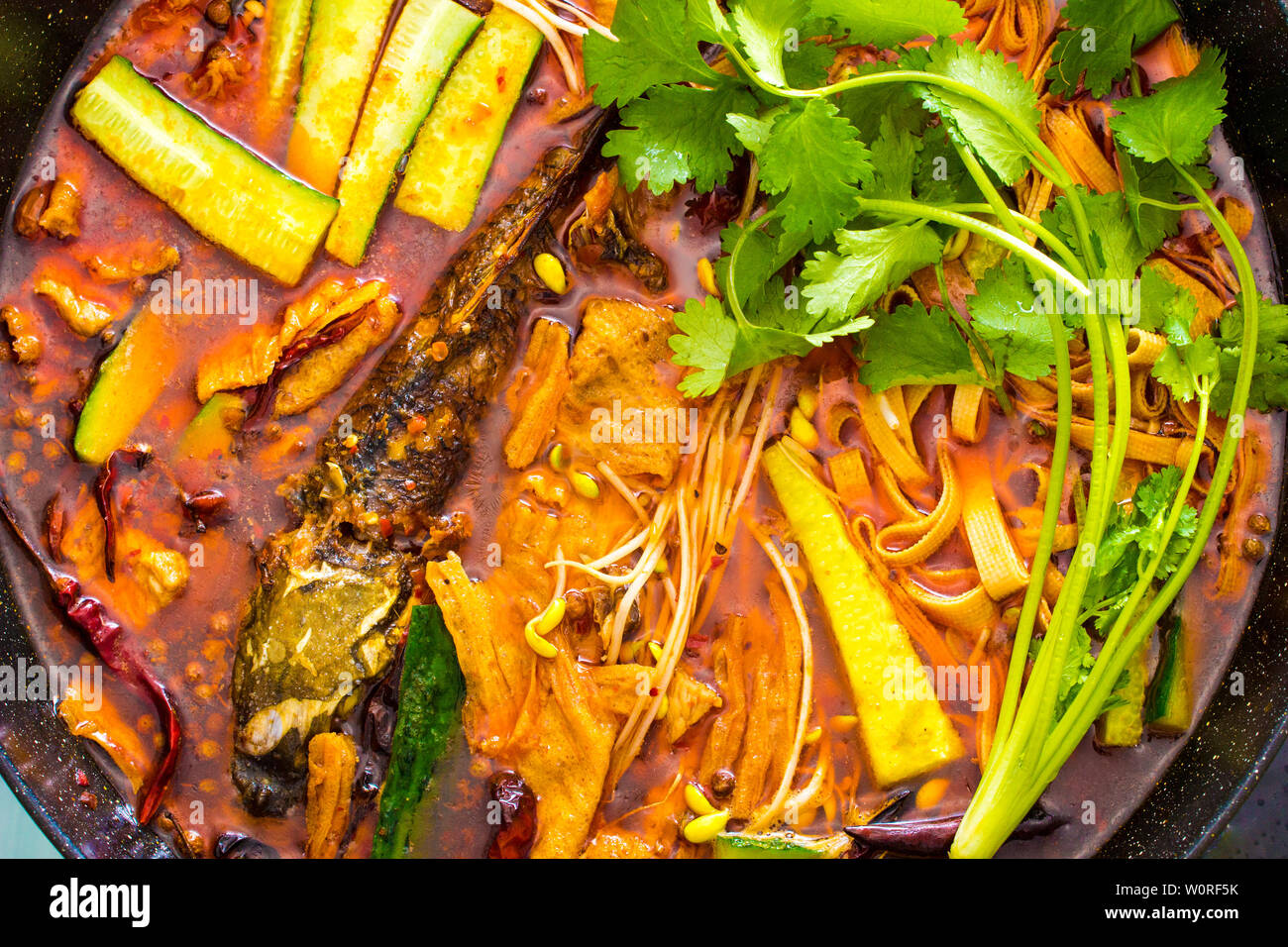 Red oil roast fish hotpot Stock Photo