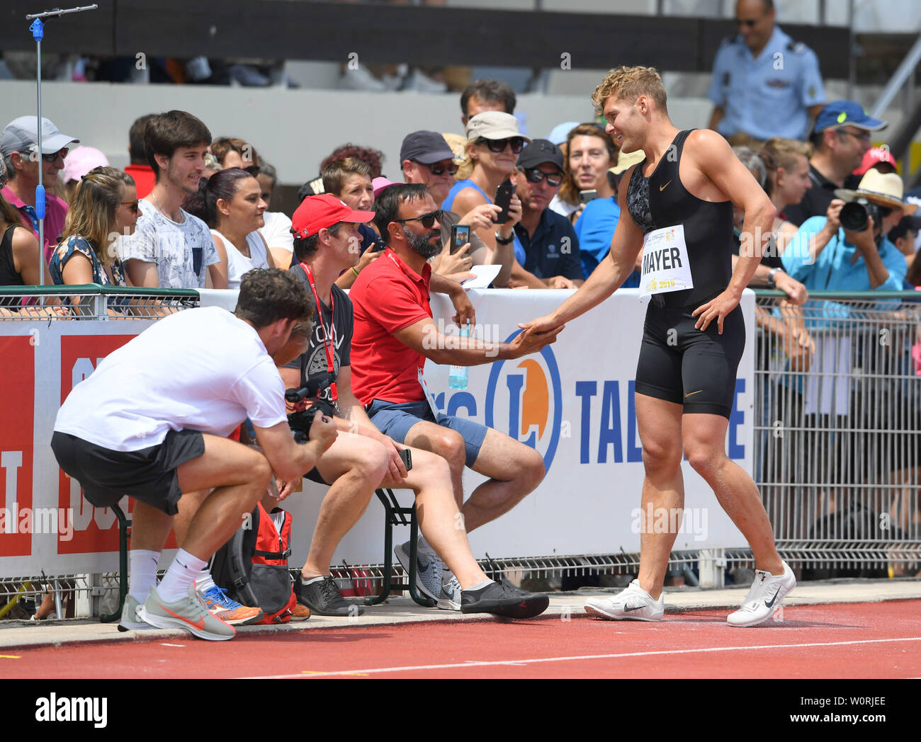 Kevin Mayer (FRA) shakes hands with coach Bertrand Valcin during the  decathlon at the DecaStar meeting,