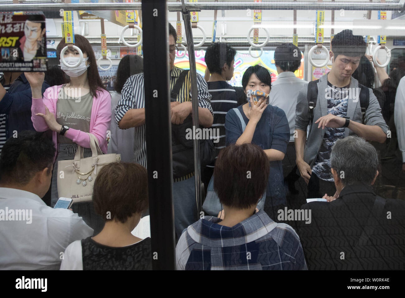 Commuters in Osaka, Japan as world leaders take over the city for the G20 Summit. Stock Photo