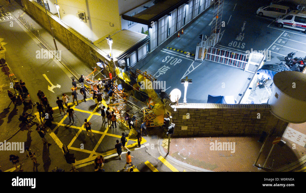 Editors Note Image Has Been Created Using A Drone Protesters Build Barricades And Taunt The Police During A Late Night Siege Of The Hong Kong Police Headquarters Stock Photo Alamy