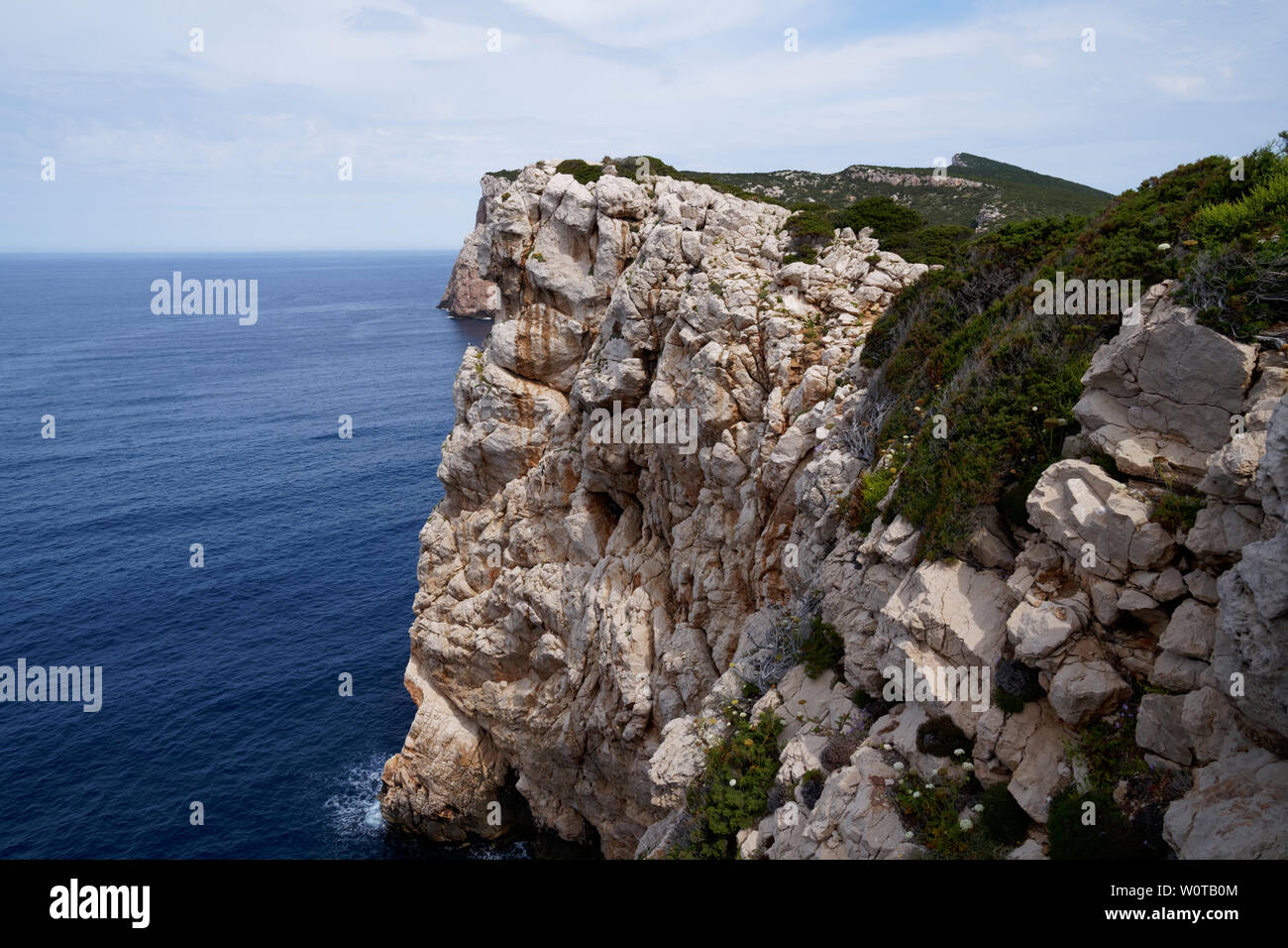 Capo Caccia, Foradada island. Imposing white limestone cliff, in Sardinia/Sardegna, Italy Stock Photo