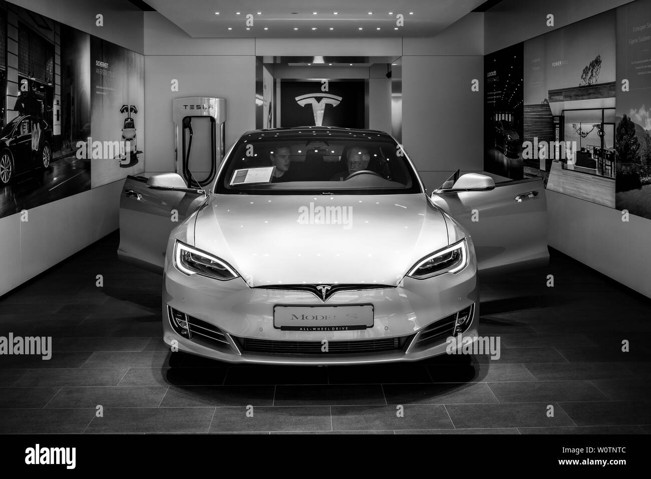 BERLIN - JUNE 09, 2018: Shoroom. Mid-size luxury car all-electric five-door liftback car Tesla Model S. Black and white. Stock Photo