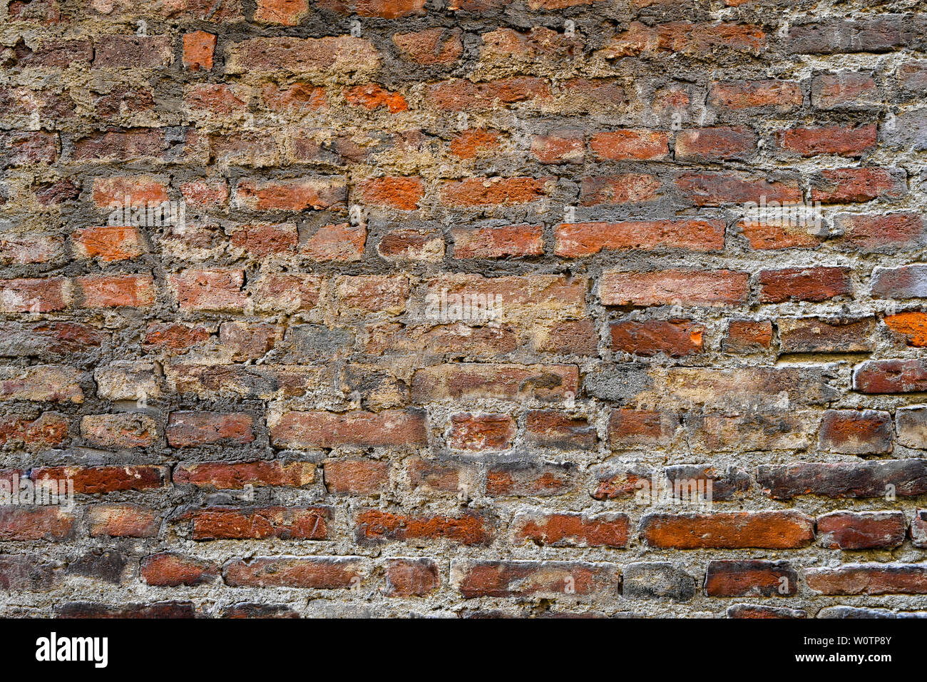 Texture of red bricks. Decorative stone. Realistic wide Red brick wall background. Template design and web banners. Stock Photo