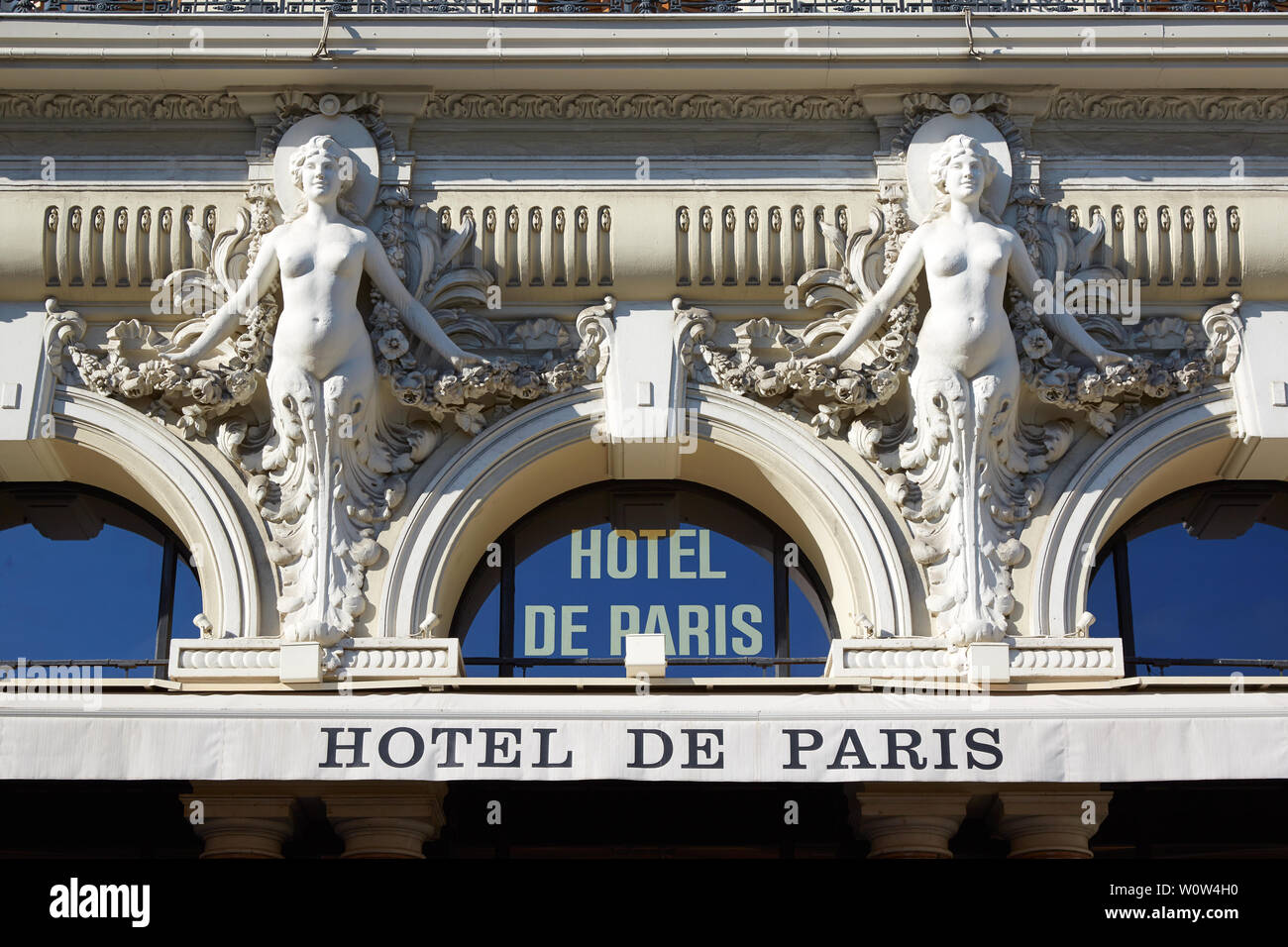 MONTE CARLO, MONACO - AUGUST 21, 2016: Hotel de Paris, luxury hotel building, sculpures detail and sign in a summer day in Monte Carlo, Monaco. Stock Photo