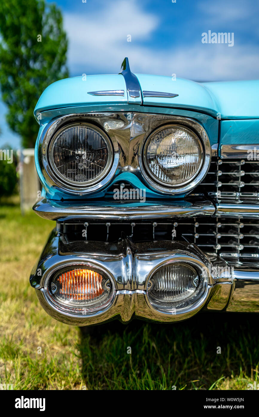 PAAREN IM GLIEN, GERMANY - MAY 19, 2018: Headlamp of a full-size luxury car Cadillac Coupe de Ville, 1960. Die Oldtimer Show 2018. Stock Photo
