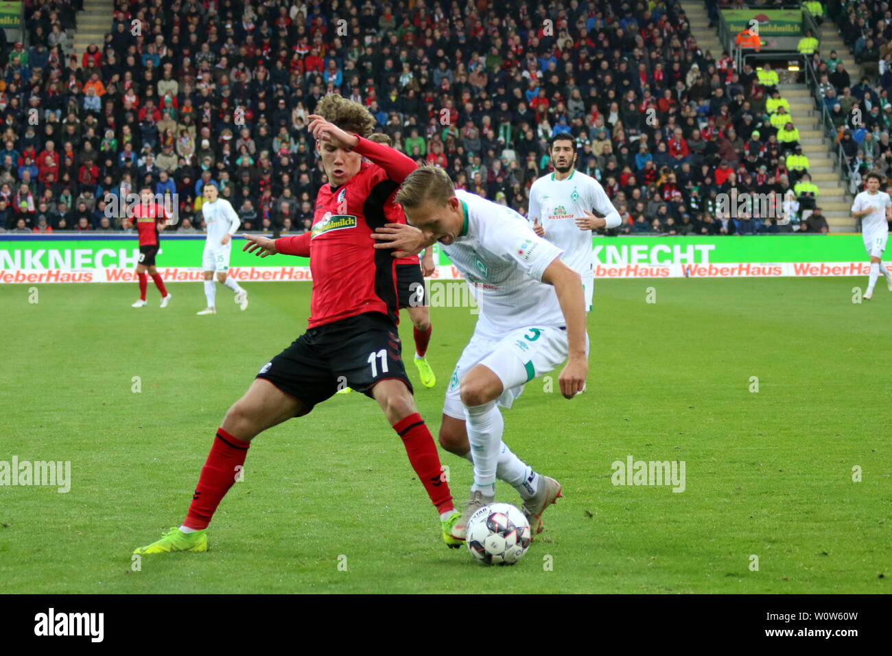 v. li. im Zweikampf  , Luca Waldschmidt (Freiburg), Ludwig Augustinsson (SV Werder Bremen),   1. BL: 18-19: 12. Sptg. -  SC Freiburg vs. SV Werder Bremen  DFL REGULATIONS PROHIBIT ANY USE OF PHOTOGRAPHS AS IMAGE SEQUENCES AND/OR QUASI-VIDEO  Foto: Joachim Hahne/johapress Stock Photo