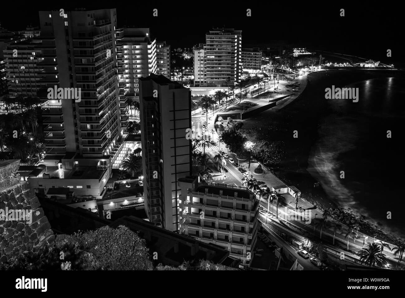PUERTO DE LA CRUZ, CANARY ISLANDS, SPAIN - JULY 30, 2018: A view of the night city from a height. Viewpoint: Mirador La Paz. Black and White. Stock Photo