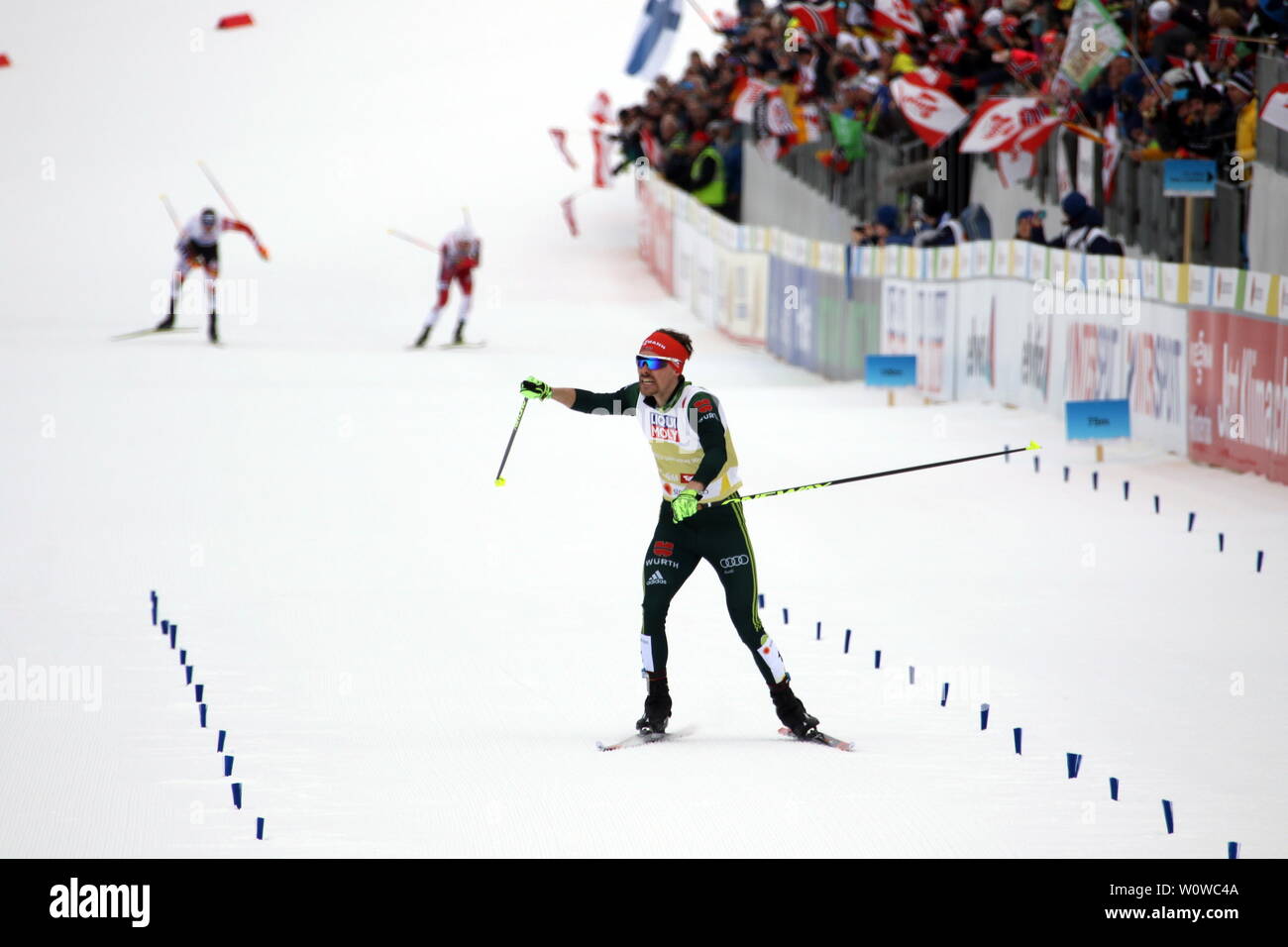 Die Konkurrenz aus Norwegen und Österreich ist geschlagen, Fabian Riessle (SZ Breitnau /Deutschland) bejubelt beim Zieleinlauf den WM-Titel beim Teamsprint Nordic Combined FIS Nordische Ski-WM 2019 in Seefeld Stock Photo