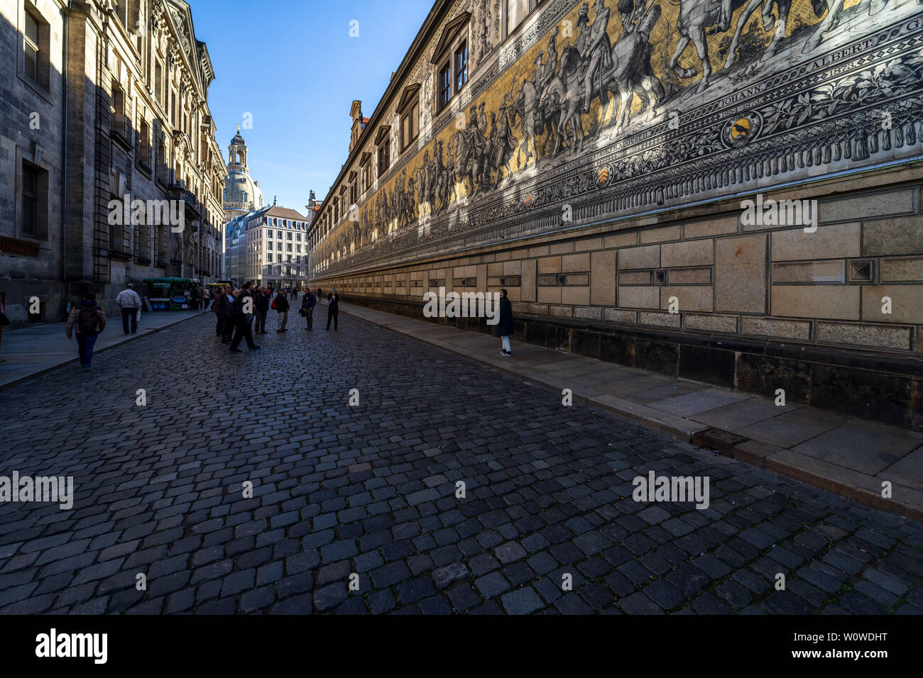 DRESDEN, GERMANY - OCTOBER 31, 2018: The Fuerstenzug (Procession of Princes) on Augustusstrasse. Fuerstenzug is the famous Meissen porcelain wall tile panel. Dresden is the capital city of the Free State of Saxony. Stock Photo