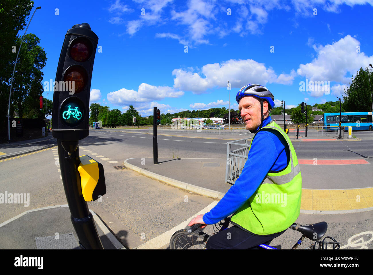 cyclist at dedicated cycle traffic light on leeds cycle super highway yorkshire united kingdom Stock Photo