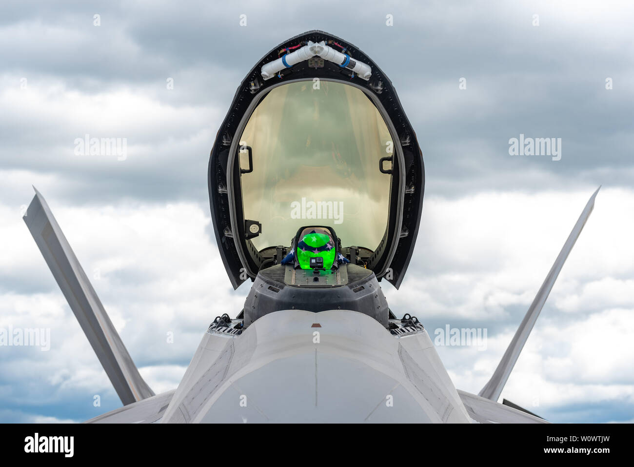 The F-22 Raptor sits on display before performing an aerial demonstration at the SkyFest air show in Spokane, Wash., June 22, 2019. Representing the U.S. Air Force and Air Combat Command, the F-22 Demo Team travels to 25 air shows a season to showcase the performance and capabilities of the world's premier 5th-generation fighter. (U.S. Air Force photo by 2nd Lt. Samuel Eckholm) Stock Photo