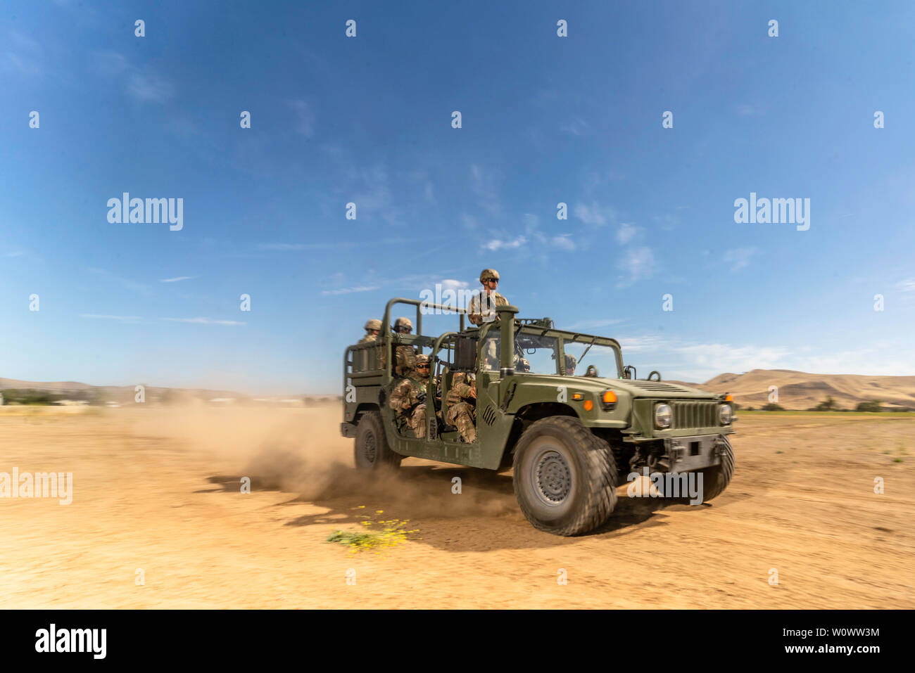 Soldiers of 40th Infantry Division pose during a staged photography operation during 2019's Annual Training on Camp Roberts Training Base, California, June 26. Soldiers were testing new High Mobility Multipurpose Wheeled Vehicle (HMMWV) modification kits in the field during this AT.  (U.S. Army photo by Sgt. Jack J. Adamyk, 40th Infantry Division public affairs) Stock Photo