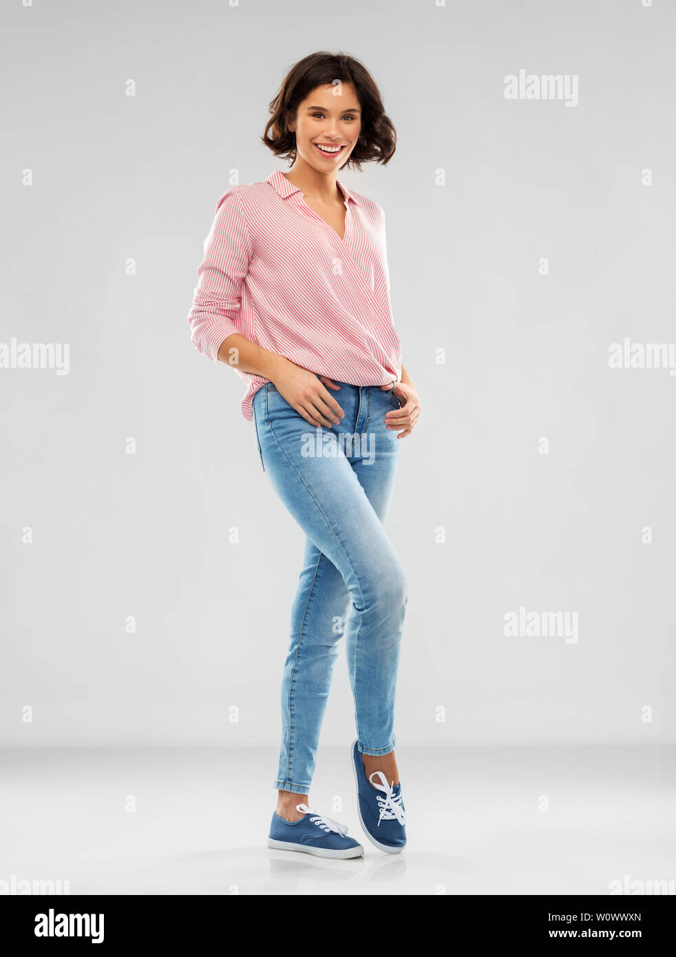 Brunette slim model in jeans and sports bra. Stock Photo by ©studioluckyaa  253571110
