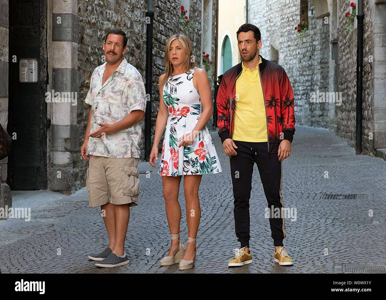 Murder Mystery is a 2019 American comedy mystery film directed by Kyle Newacheck and written by James Vanderbilt. The film stars Adam Sandler, Jennifer Aniston, and Luke Evans,   This photograph is supplied for editorial use only and is the copyright of the film company and/or the designated photographer assigned by the film or production company. Stock Photo