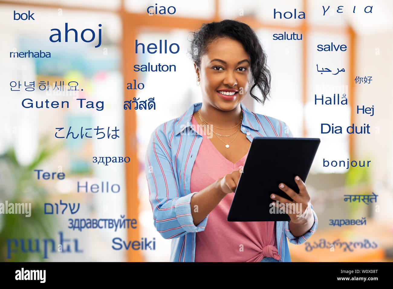 happy african american woman using tablet pc Stock Photo - Alamy