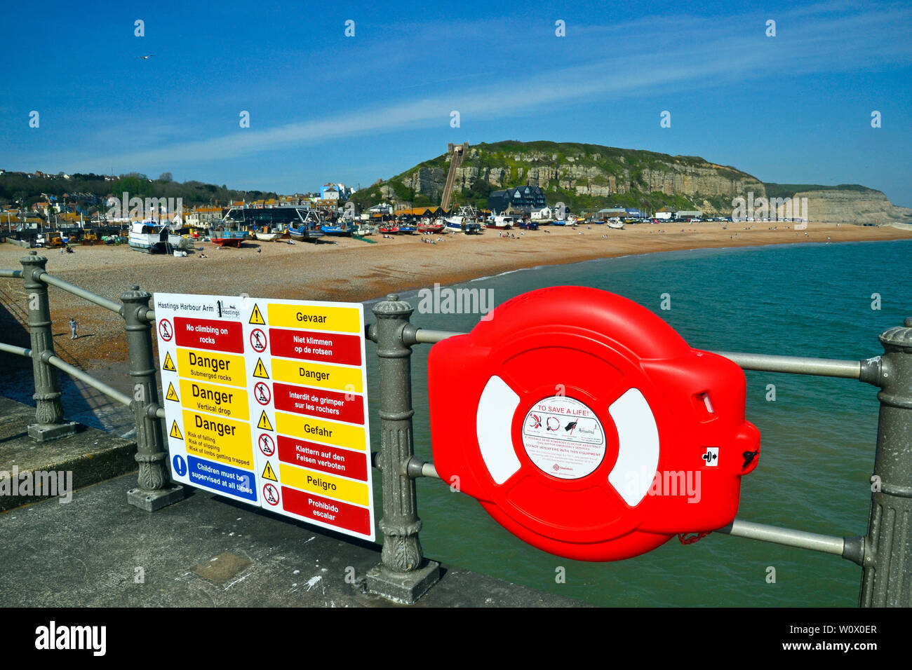 Life ring on a jetty, Hastings Beach, Hastings, East Sussex, UK Stock Photo