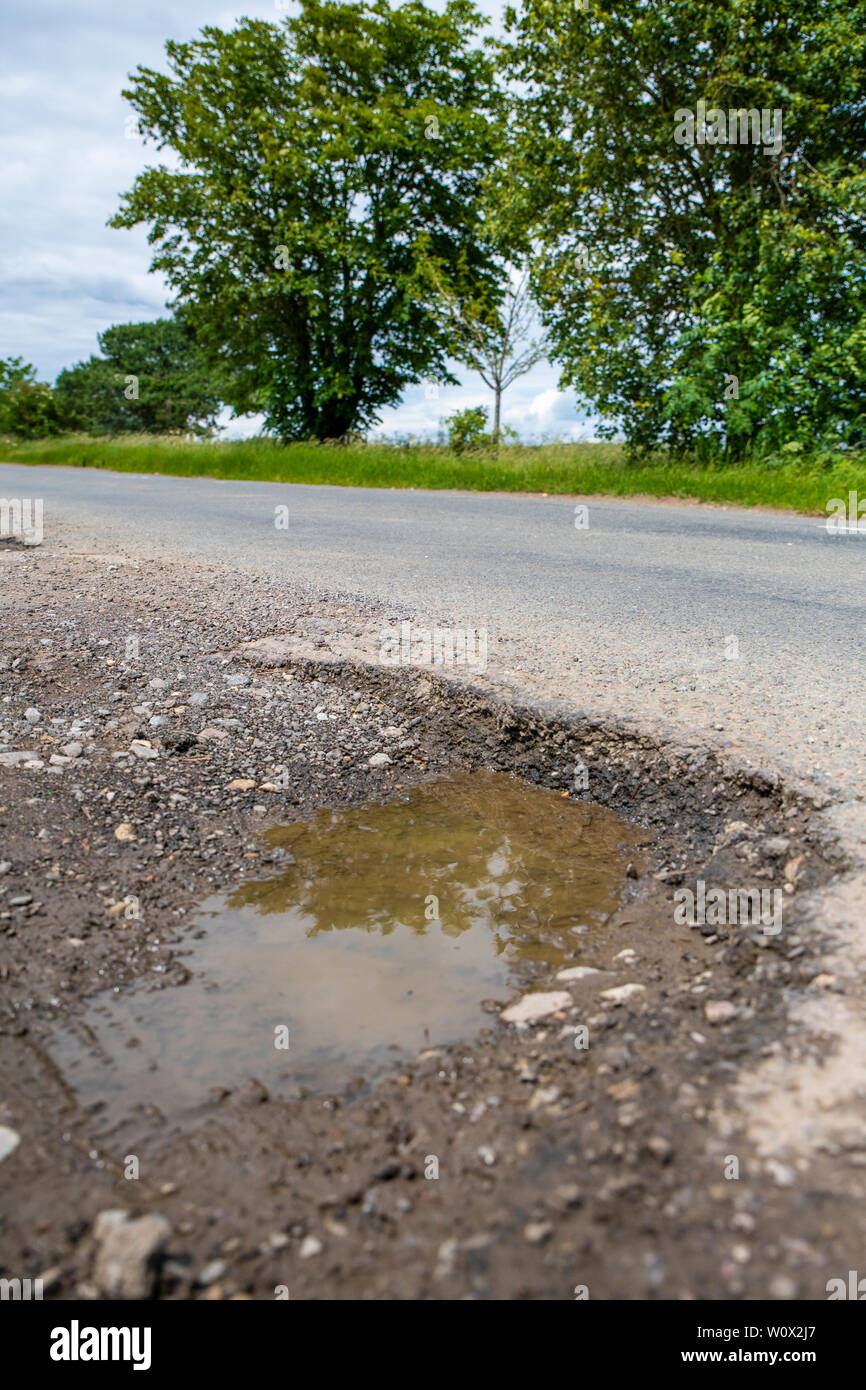Pothole. Oxford roads. Road damaged by erosion and weather. Potholes