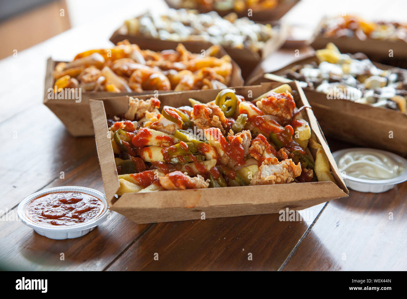 Poutine french fries curly dips gravy Stock Photo Alamy