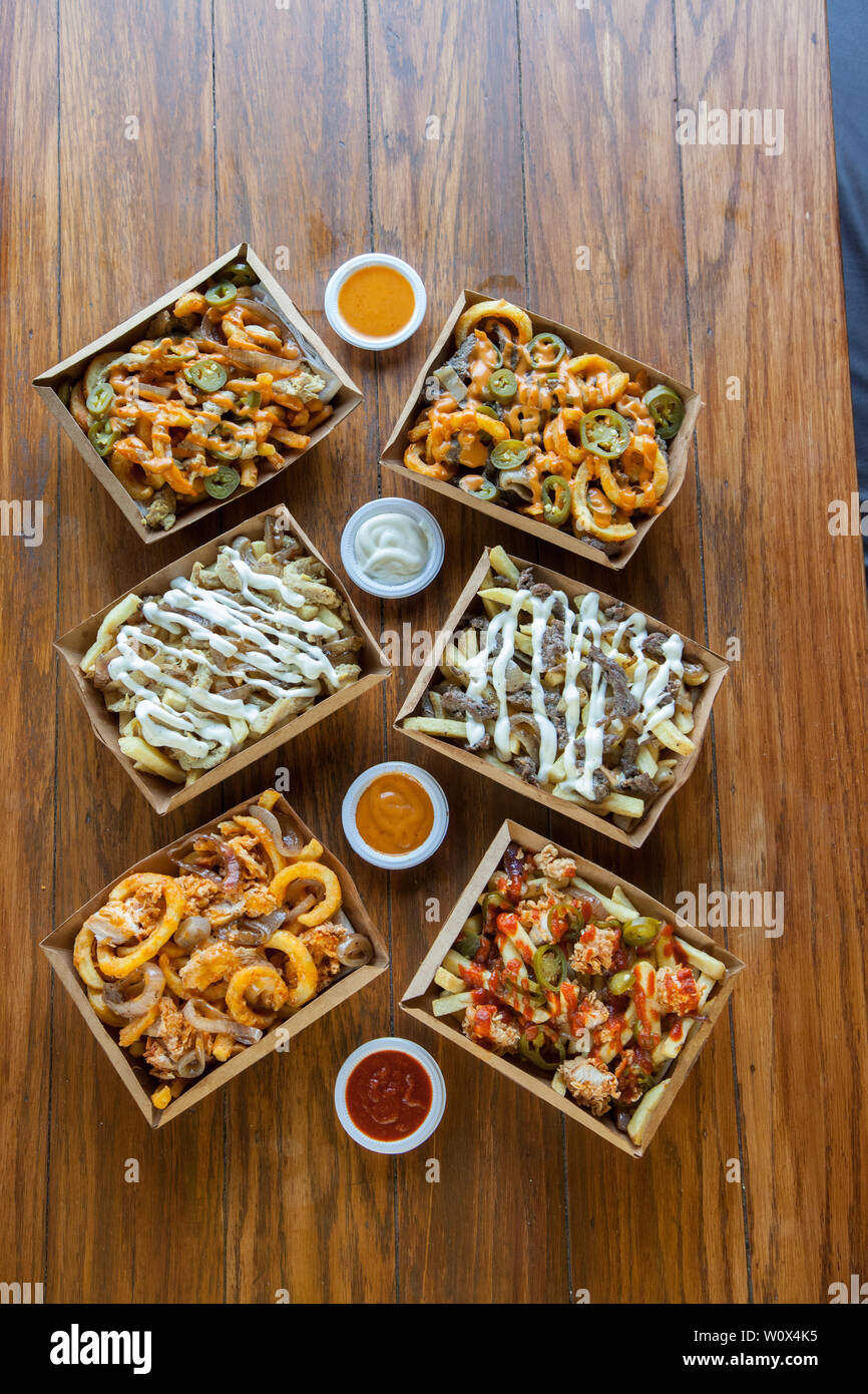 Poutine french fries curly dips gravy Stock Photo Alamy