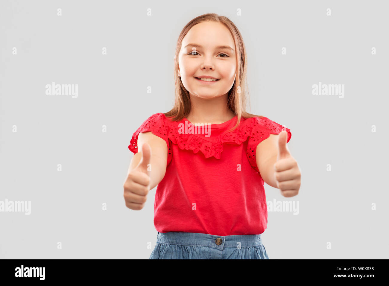 beautiful smiling girl showing thumbs up Stock Photo - Alamy