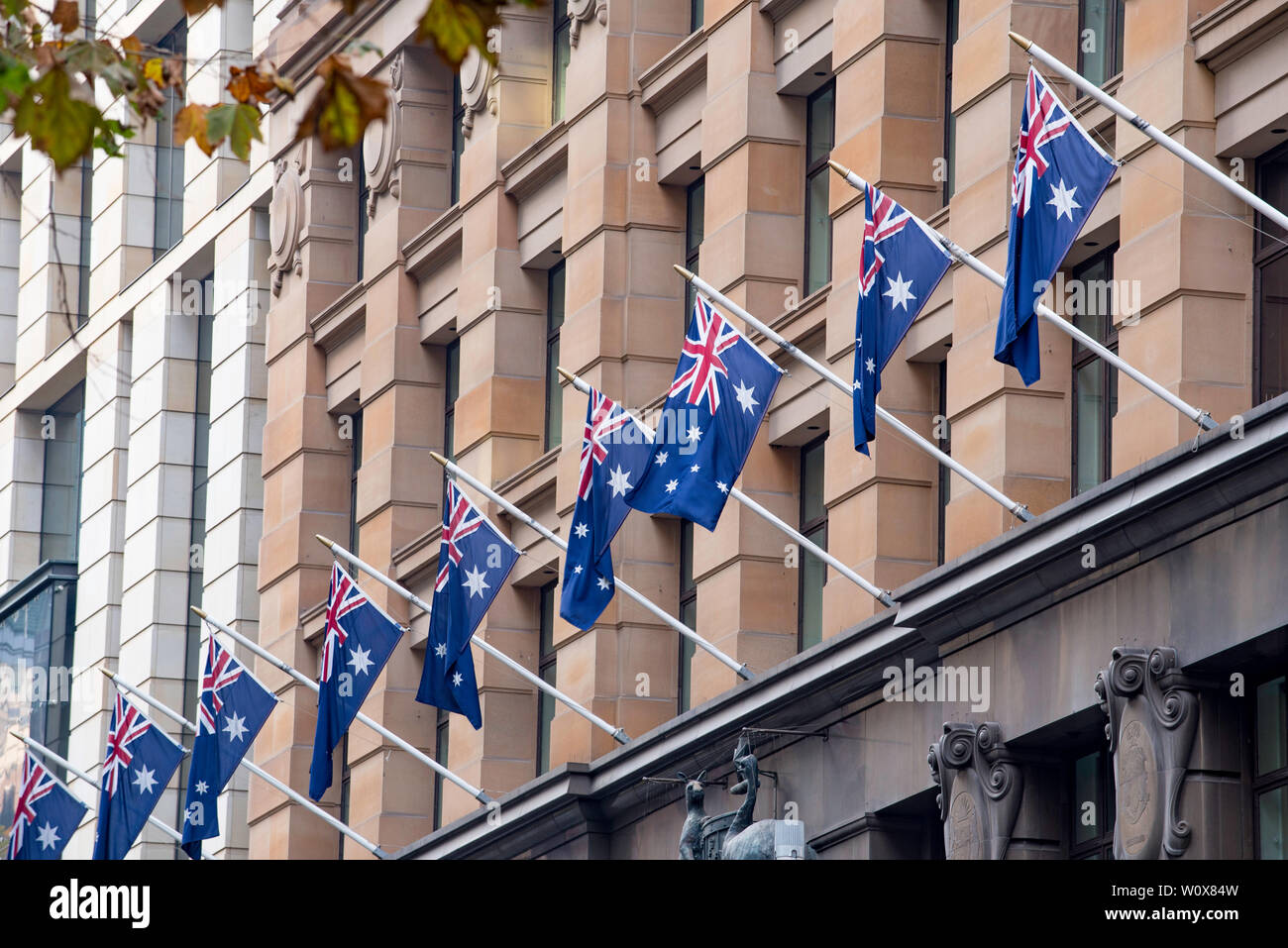 Australian flags hang from Sydney's GPO building in Martin Place. This is the point where all distances from Sydney are measured. Stock Photo