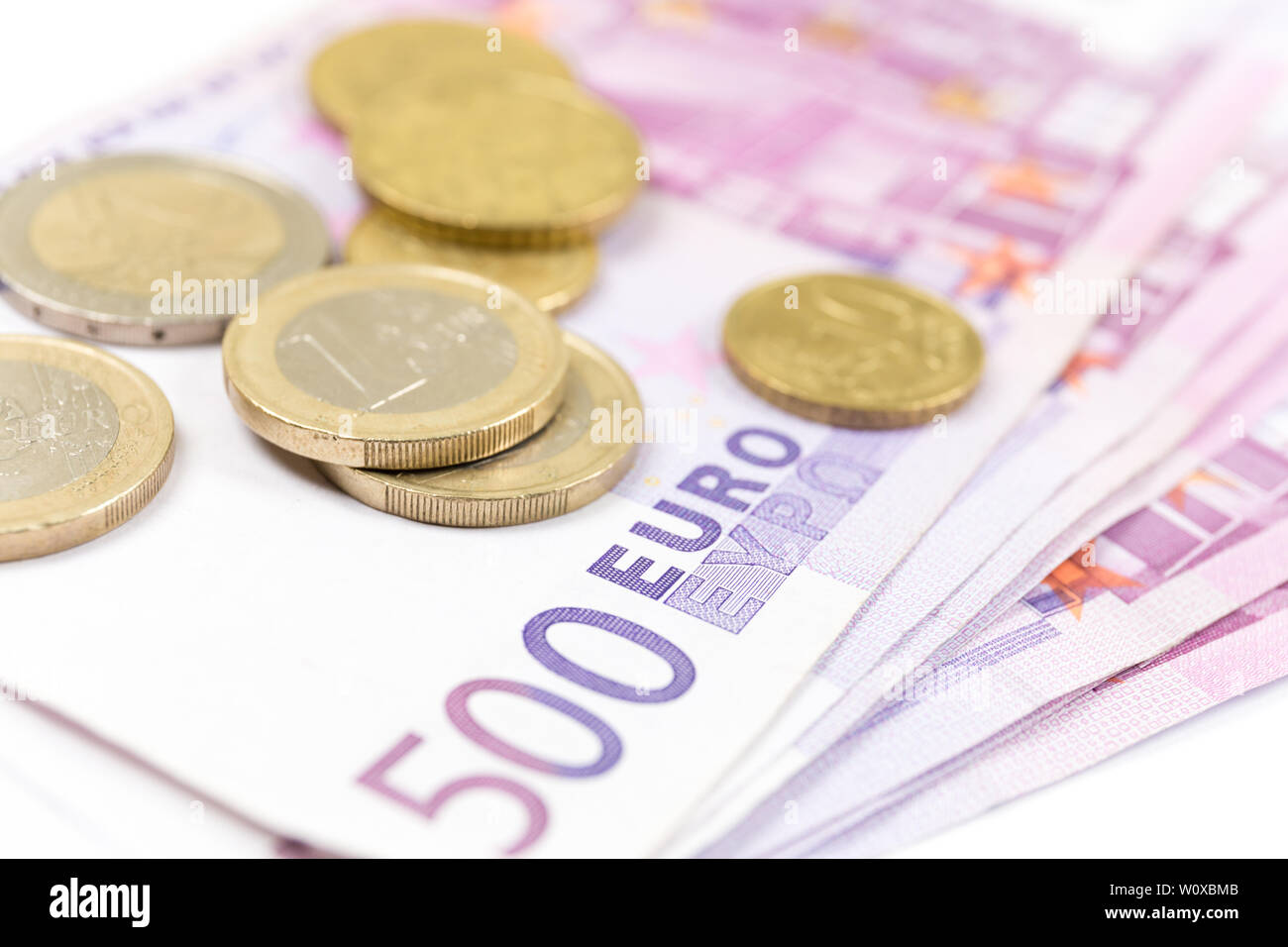 Close-up Stack of Euro banknotes and coins. 500 Euro banknotes ...