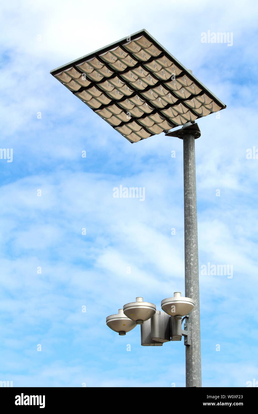 Modern LED street light reflectors in protective case pointed towards large reflective panels