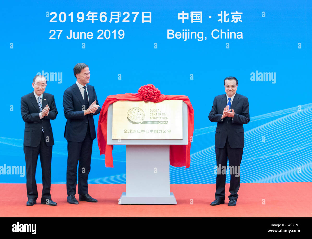 Beijing, China. 27th June, 2019. Chinese Premier Li Keqiang (R), Dutch Prime Minister Mark Rutte (C) and former UN Secretary-General Ban Ki-moon attend the inaugural ceremony of the Global Center on Adaptation China Office at the Great Hall of the People in Beijing, capital of China, June 27, 2019. Credit: Wang Ye/Xinhua/Alamy Live News Stock Photo