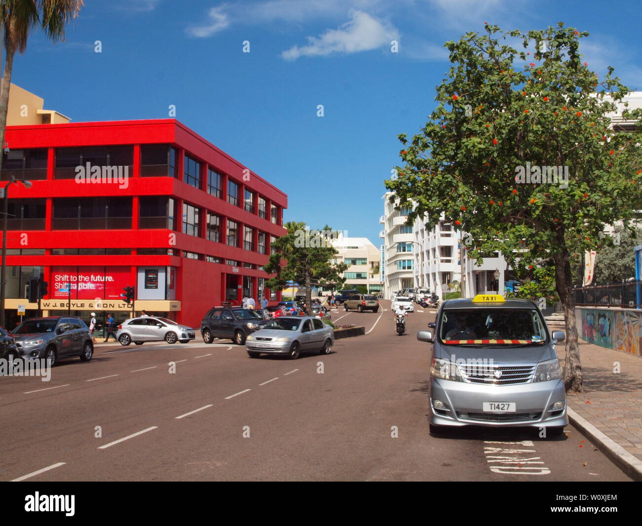 Queen and Church Streets, Hamilton, Bermuda. The red building is the Boyle Building. To the