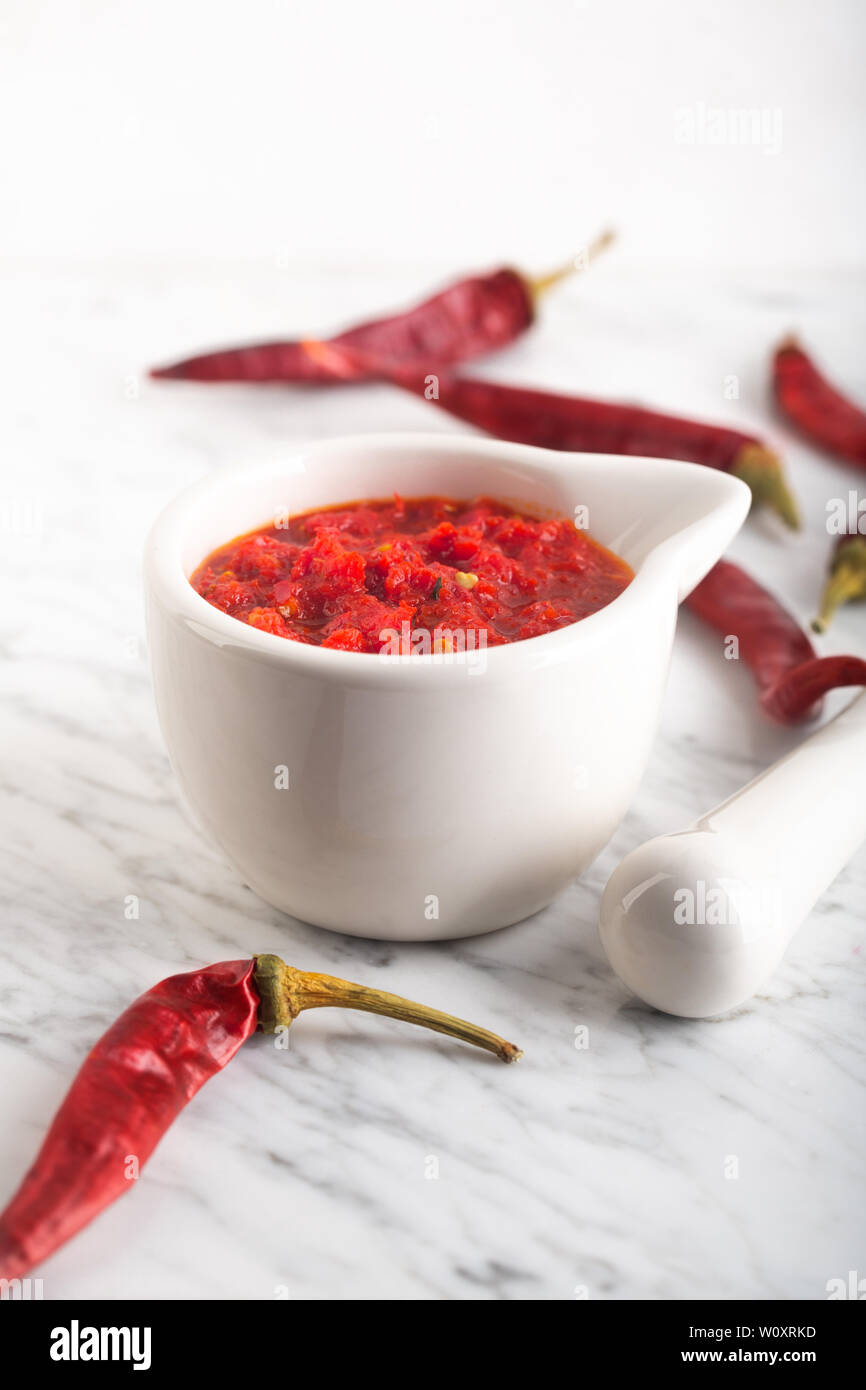 Traditional Maghrebi hot chili pepper sauce paste harissa. Tunisia and Arabic cuisine adjika