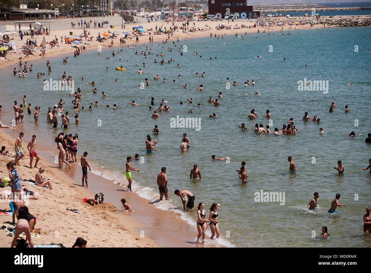 A View Of The Beach Of Nova Icaria Packed With Bathers In