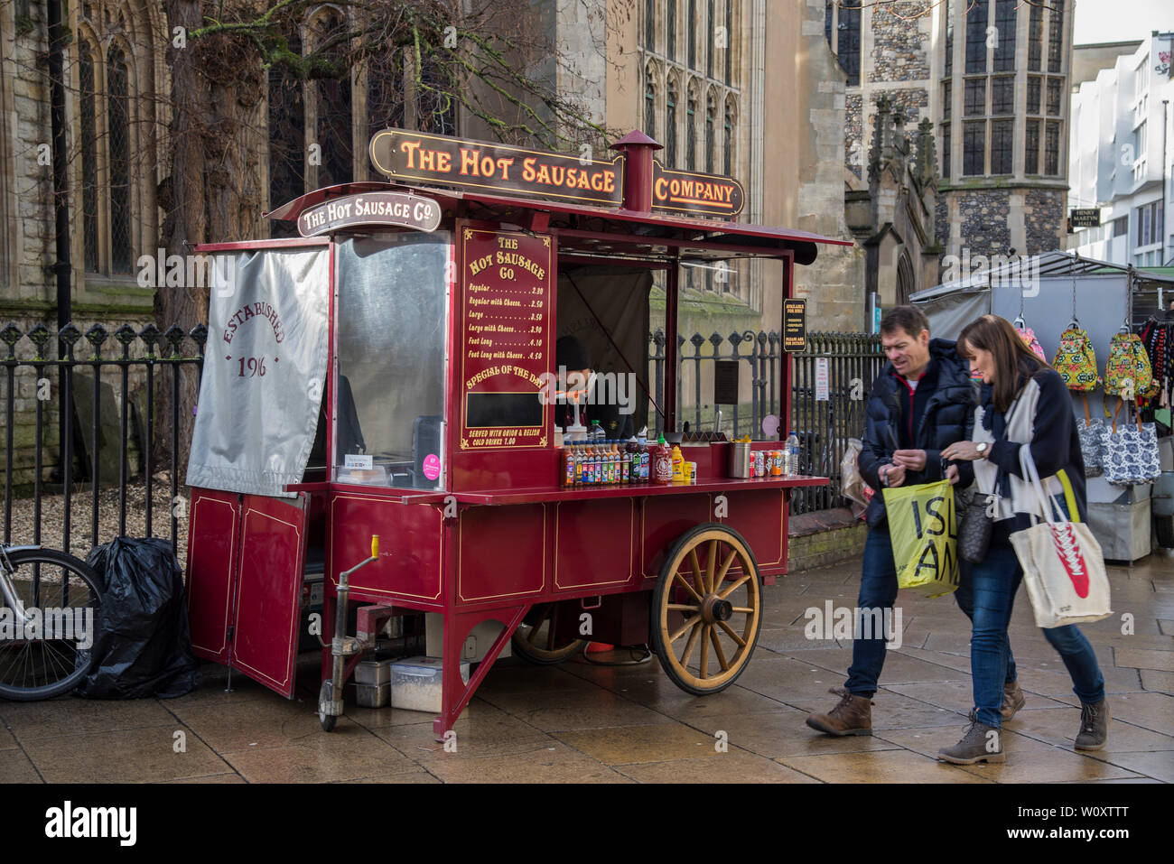 A wagoon selling hot dogs just outside St Andrew the Great Church in central Cambridge 2019 Stock Photo