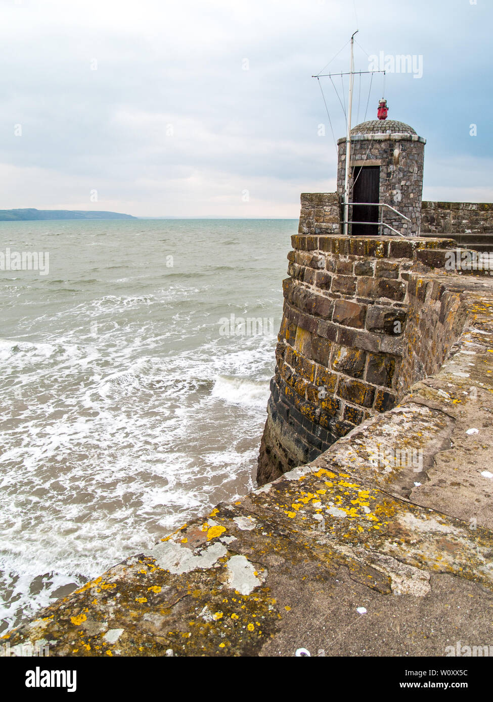The lighthouse and lookout point on the harbour wall at Saundersfoot in Pembrokeshire, West Wales, UK. Stock Photo