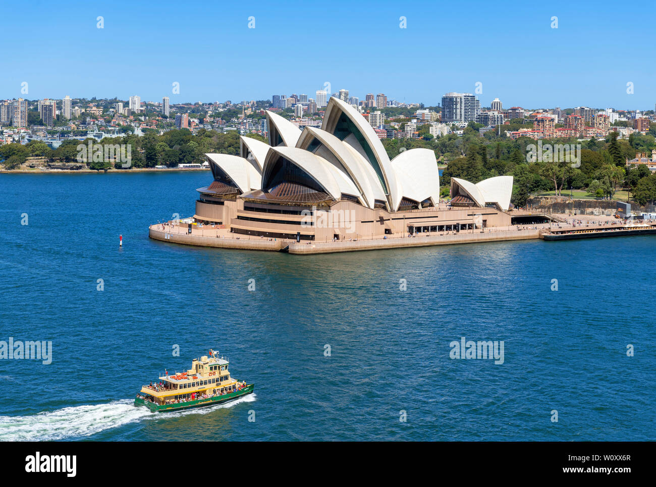 Harbour ferry in front of the Sydney Opera House, Sydney, New South Wales, Australia Stock Photo